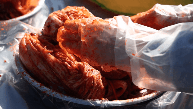 Kimchi being prepared in a bowl