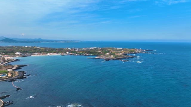 Coastal village with clear blue sea