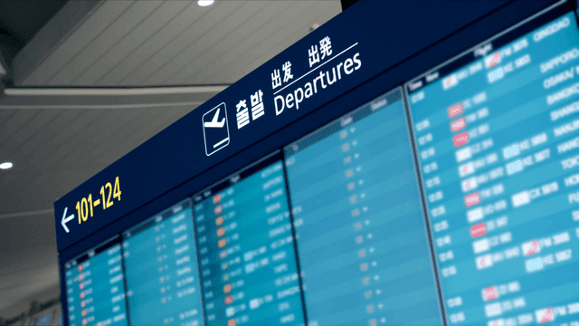 Departure board at an airport terminal