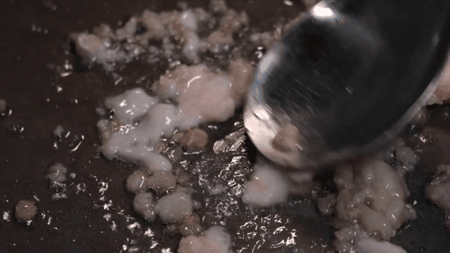 Cooking meat in a pan with oil