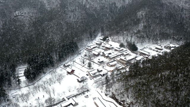 Temple located in the middle of a snow-covered mountain