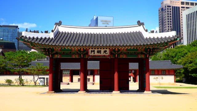 Gate of Deoksugung Palace showing traditional Korean architecture on a sunny day