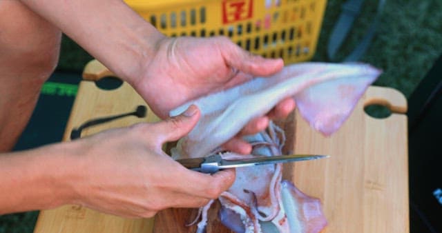 Preparing Squid on a Cutting Board Outdoors