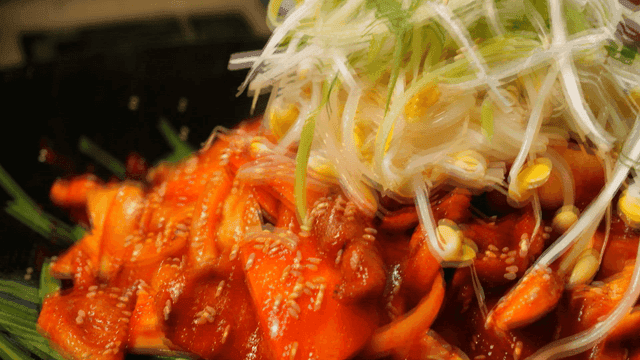 Red pepper paste bulgogi topped with bean sprouts and shredded green onions