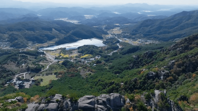 Vast mountain landscape with distant lake