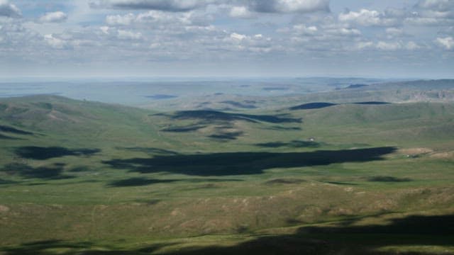 Cloudy Skies and Vast Plains