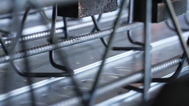 Metal rods being welded in a factory