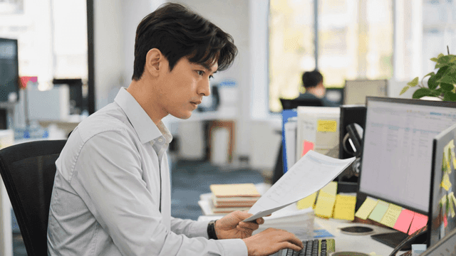 Man working in front of monitor at office desk