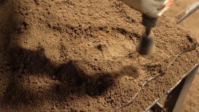 Scene of soil being compacted with a machine