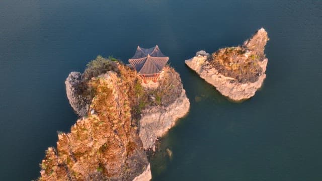 Traditional pavilion on rocky islets