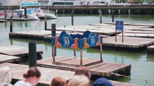 Iconic Pier Signage at a Busy Tourist Location