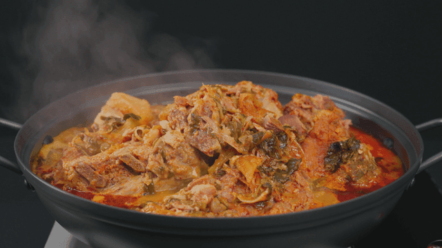 Pork backbone stew boiling in pot