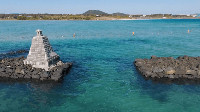 Tranquil sea with a stone structure