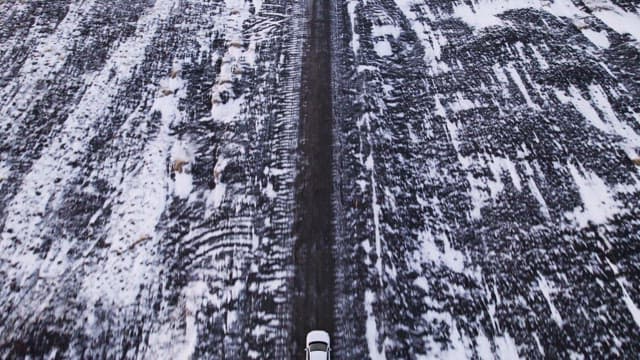 Car driving on a snowy road