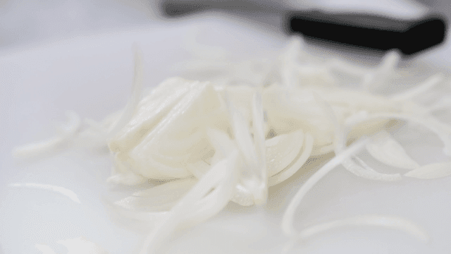 Sliced onions on a cutting board