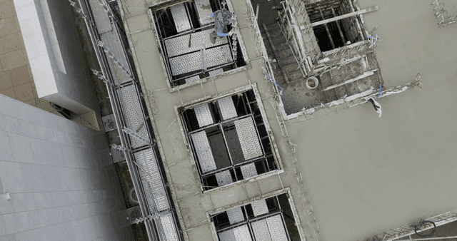 Construction site with workers and scaffolding