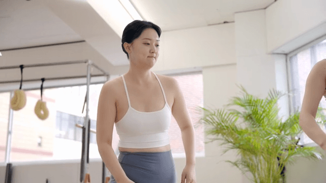 Woman practicing yoga indoors