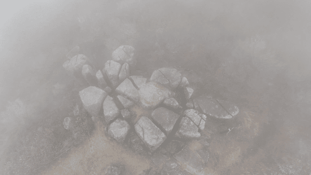 Foggy mountain with large rocks