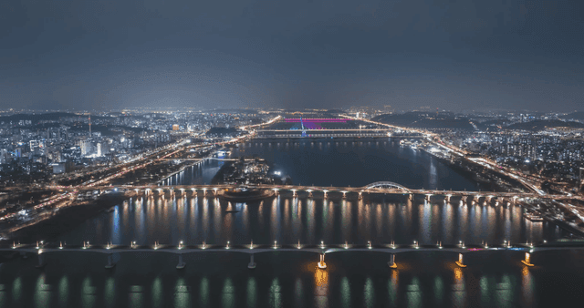 Night view of a city with illuminated bridges