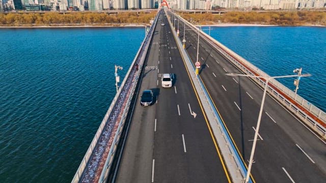 Cars on a Straight Bridge over River