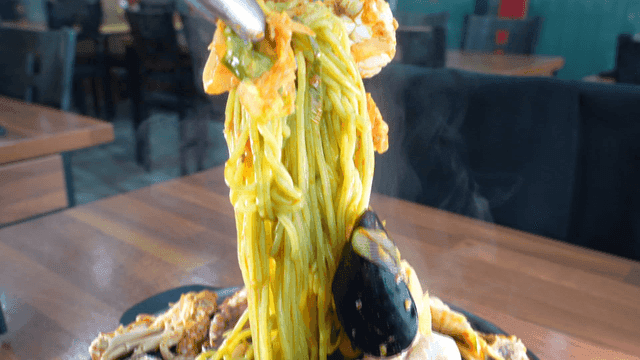 Tongs for scooping out steaming seafood jjamppong noodles