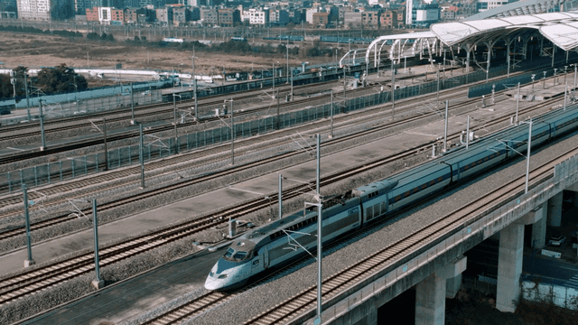 High-speed train passing through a station
