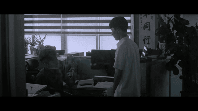 Serious student and teacher talking in dark teachers’ office