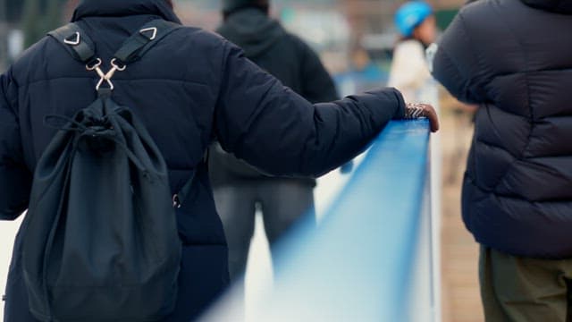 People skating on an outdoor ice rink