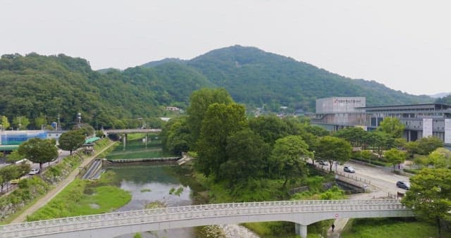 Scenic view of mountains and a modern building