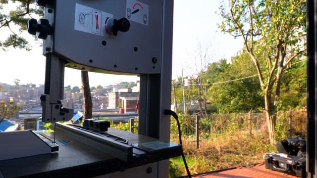 Industrial machine with cityscape in the background