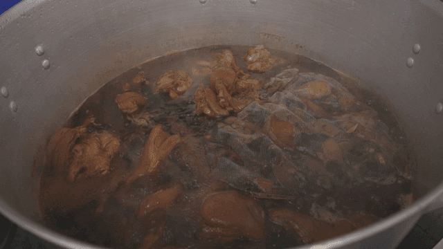 Pork hocks simmering in a large pot