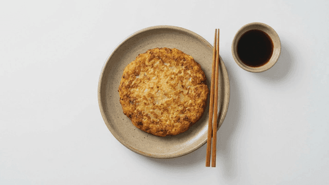 Mung bean pancake and soy sauce on plate