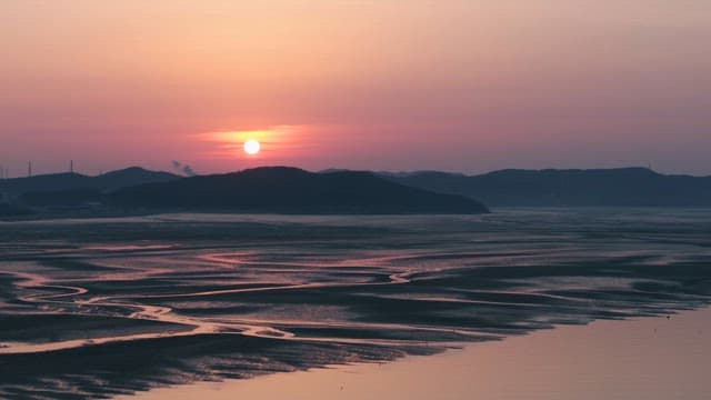 Serene Sunset Over Coastal Wetlands