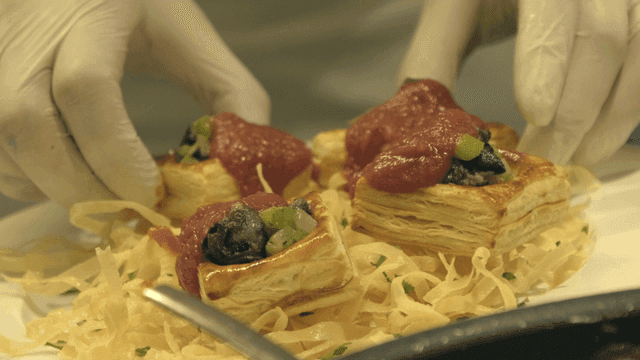 Preparing gourmet pastries with sauce