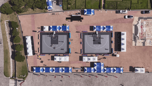 Outdoor basketball court with people