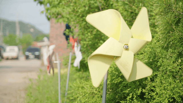 Yellow pinwheel spinning in the breeze