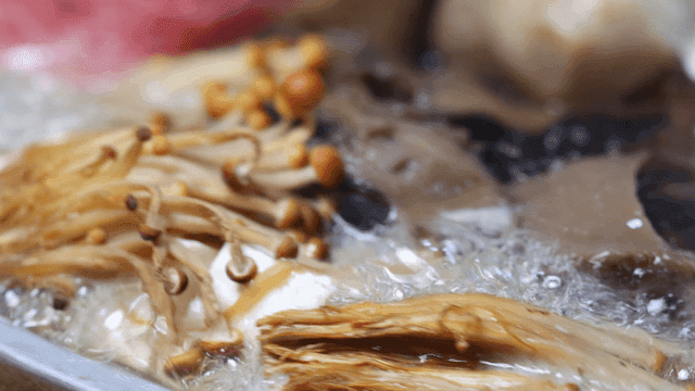 Mushroom stew boiling in pot
