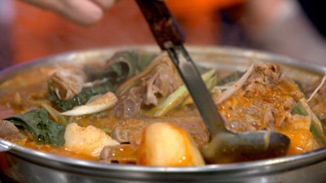 Napa cabbage and pork backbone stew boiling in a pot