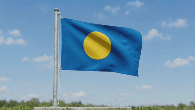 Palau flag fluttering in clear sky
