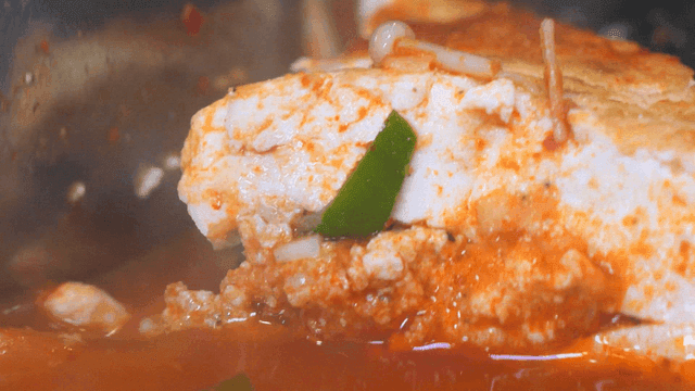 Tofu simmering in spicy broth