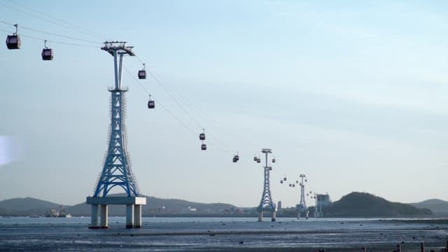 Cable car at dusk on the mudflats exposed by low tide