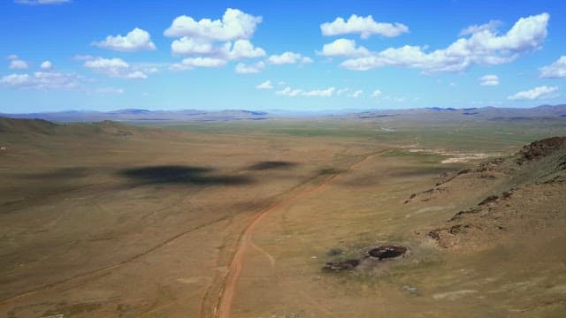 Vast open landscape with distant mountains