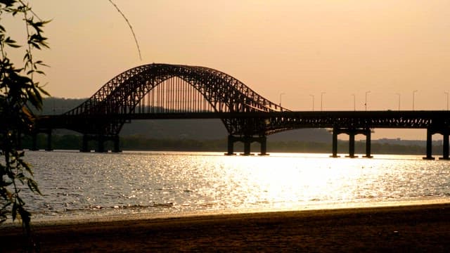 Bridge over a river at sunset