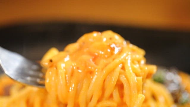 Rose pasta with steam rising from it