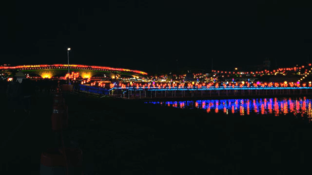 Colorful festival lights reflected in the river