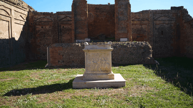 Ancient ruins with a carved stone altar