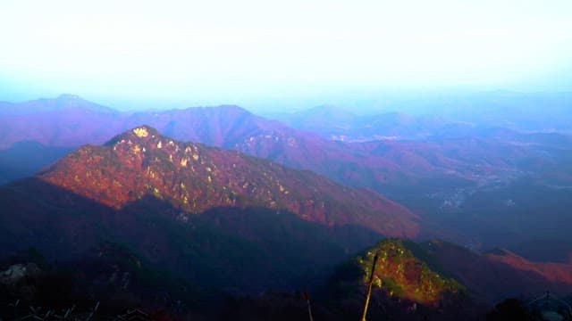 Panoramic view of a mountainous region with autumn foliage