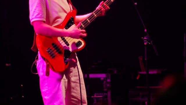 Musician Playing Bass Guitar on Stage