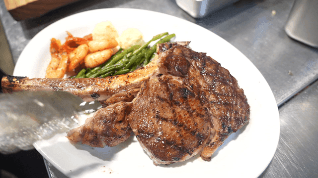 Plate with steak, shrimp, and vegetables
