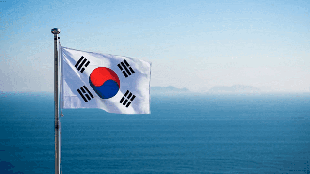 Korean flag waving by the sea
